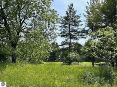 Beautiful, and lightly treed, lot overlooks the 4th fairway at on Shanty Creek Golf Course in Michigan - for sale on GolfHomes.com, golf home, golf lot