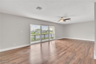 Wonderful second floor 2/2 unit looking out on the water of the on The Glades Golf and Country Club in Florida - for sale on GolfHomes.com, golf home, golf lot