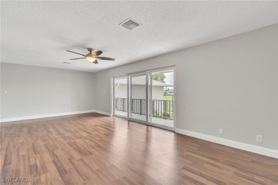 Wonderful second floor 2/2 unit looking out on the water of the on The Glades Golf and Country Club in Florida - for sale on GolfHomes.com, golf home, golf lot
