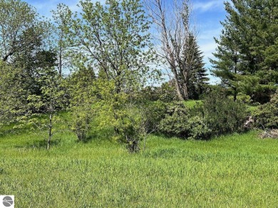 Beautiful, and lightly treed, lot overlooks the 4th fairway at on Shanty Creek Golf Course in Michigan - for sale on GolfHomes.com, golf home, golf lot