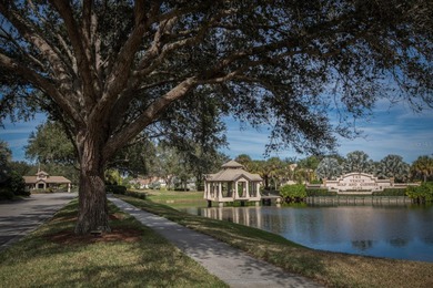 Exceptional courtyard home providing a refined blend of comfort on The Venice Golf and Country Club in Florida - for sale on GolfHomes.com, golf home, golf lot