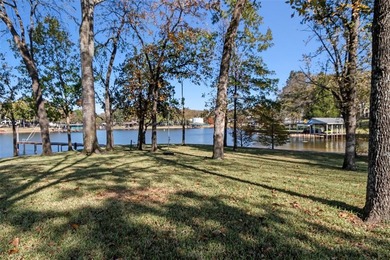 Located on a beautiful 0.87-acre treed lot with 396 feet of on Pinnacle Golf and Boat Club in Texas - for sale on GolfHomes.com, golf home, golf lot