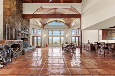 Passing through a custom lava rock gated entry to the impressive on Fall River Valley Golf and Country Club in California - for sale on GolfHomes.com, golf home, golf lot