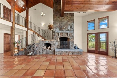 Passing through a custom lava rock gated entry to the impressive on Fall River Valley Golf and Country Club in California - for sale on GolfHomes.com, golf home, golf lot