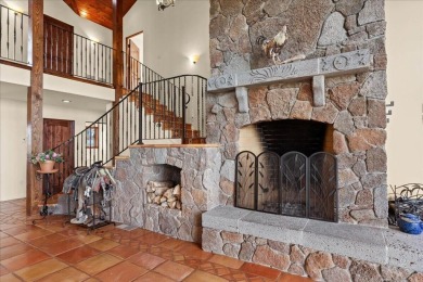 Passing through a custom lava rock gated entry to the impressive on Fall River Valley Golf and Country Club in California - for sale on GolfHomes.com, golf home, golf lot