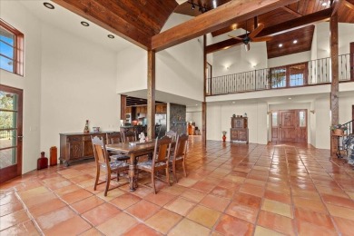 Passing through a custom lava rock gated entry to the impressive on Fall River Valley Golf and Country Club in California - for sale on GolfHomes.com, golf home, golf lot