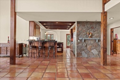 Passing through a custom lava rock gated entry to the impressive on Fall River Valley Golf and Country Club in California - for sale on GolfHomes.com, golf home, golf lot