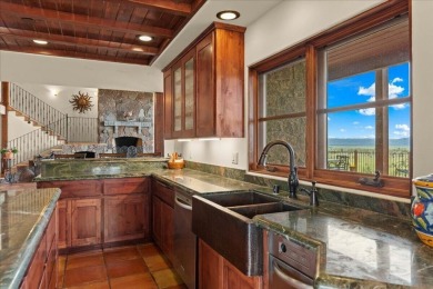 Passing through a custom lava rock gated entry to the impressive on Fall River Valley Golf and Country Club in California - for sale on GolfHomes.com, golf home, golf lot