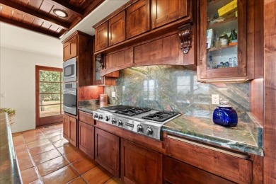 Passing through a custom lava rock gated entry to the impressive on Fall River Valley Golf and Country Club in California - for sale on GolfHomes.com, golf home, golf lot