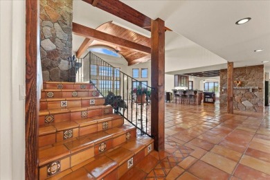 Passing through a custom lava rock gated entry to the impressive on Fall River Valley Golf and Country Club in California - for sale on GolfHomes.com, golf home, golf lot