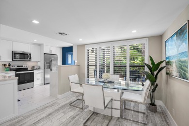 Welcome to this inviting 1st‑floor home showcasing serene on Quail Ridge Golf Course and Country Club in Florida - for sale on GolfHomes.com, golf home, golf lot