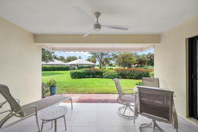 Welcome to this inviting 1st‑floor home showcasing serene on Quail Ridge Golf Course and Country Club in Florida - for sale on GolfHomes.com, golf home, golf lot