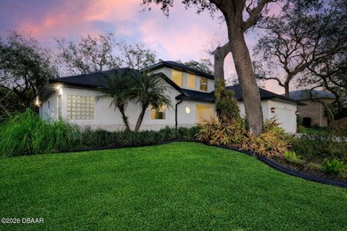 Set on an expansive golf course lot with mature, lush on Spruce Creek Golf Club in Florida - for sale on GolfHomes.com, golf home, golf lot