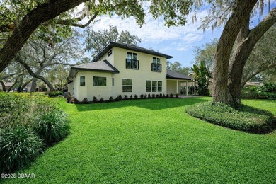 Set on an expansive golf course lot with mature, lush on Spruce Creek Golf Club in Florida - for sale on GolfHomes.com, golf home, golf lot