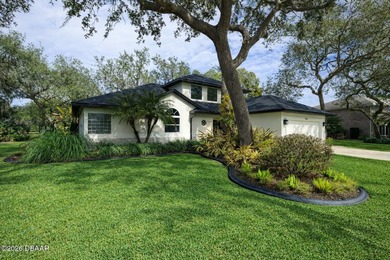 Set on an expansive golf course lot with mature, lush on Spruce Creek Golf Club in Florida - for sale on GolfHomes.com, golf home, golf lot