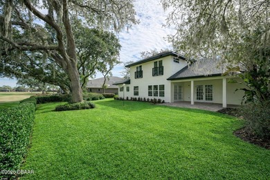 Set on an expansive golf course lot with mature, lush on Spruce Creek Golf Club in Florida - for sale on GolfHomes.com, golf home, golf lot