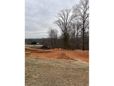 Elevate your living experience on this gently sloping, .66 acre on Dandridge Golf and Country Club in Tennessee - for sale on GolfHomes.com, golf home, golf lot