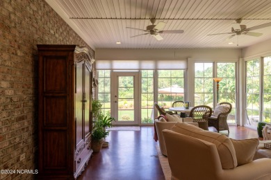 Situated on a picturesque half-acre lot, this beautiful home on Beau Rivage Golf and Resort in North Carolina - for sale on GolfHomes.com, golf home, golf lot