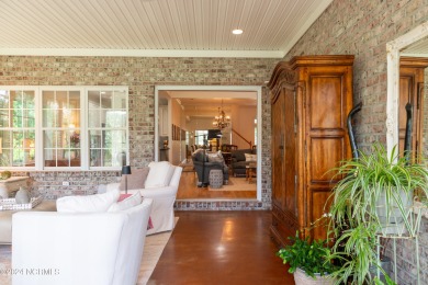 Situated on a picturesque half-acre lot, this beautiful home on Beau Rivage Golf and Resort in North Carolina - for sale on GolfHomes.com, golf home, golf lot