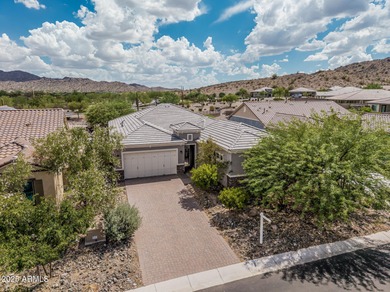 Welcome to Estrella Mountain living at its finest-a former model on Estrella Mountain Ranch Golf Course in Arizona - for sale on GolfHomes.com, golf home, golf lot