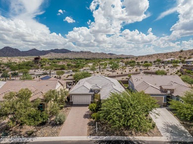 Welcome to Estrella Mountain living at its finest-a former model on Estrella Mountain Ranch Golf Course in Arizona - for sale on GolfHomes.com, golf home, golf lot