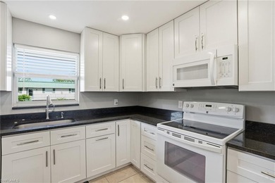 Tastefully renovated split 2 bed 2 bath second floor condo with on Hibiscus Golf Club in Florida - for sale on GolfHomes.com, golf home, golf lot