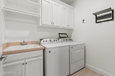 Welcome to this 3-car garage Palencia home with a split on The Palencia Club in Florida - for sale on GolfHomes.com, golf home, golf lot