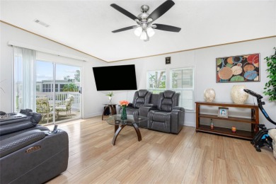 This cute and charming 2 bedroom, 2 bath manufactured home is on Maple Leaf Golf and Country Club in Florida - for sale on GolfHomes.com, golf home, golf lot