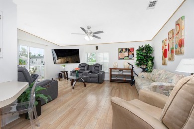 This cute and charming 2 bedroom, 2 bath manufactured home is on Maple Leaf Golf and Country Club in Florida - for sale on GolfHomes.com, golf home, golf lot