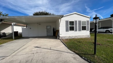 Waterfront Home With Lots Of Upgrades!! Double Wide Carport on Anglers Green Golf Course in Florida - for sale on GolfHomes.com, golf home, golf lot