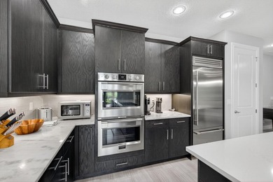 Come see this beautifully upgraded Toll Brothers Pesaro model on Jupiter Country Club in Florida - for sale on GolfHomes.com, golf home, golf lot