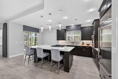 Come see this beautifully upgraded Toll Brothers Pesaro model on Jupiter Country Club in Florida - for sale on GolfHomes.com, golf home, golf lot