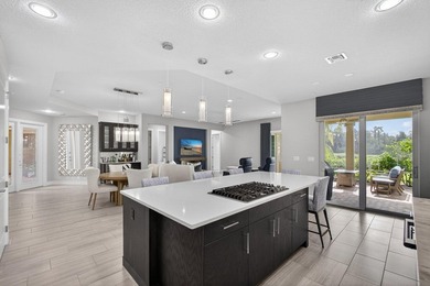 Come see this beautifully upgraded Toll Brothers Pesaro model on Jupiter Country Club in Florida - for sale on GolfHomes.com, golf home, golf lot