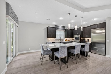 Come see this beautifully upgraded Toll Brothers Pesaro model on Jupiter Country Club in Florida - for sale on GolfHomes.com, golf home, golf lot