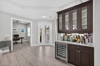Come see this beautifully upgraded Toll Brothers Pesaro model on Jupiter Country Club in Florida - for sale on GolfHomes.com, golf home, golf lot