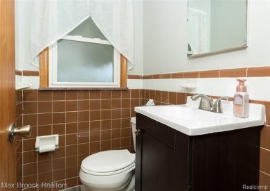 Meticulously maintained brick Ranch on a double lot in South on Western Golf and Country Club in Michigan - for sale on GolfHomes.com, golf home, golf lot