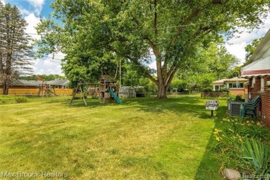 Meticulously maintained brick Ranch on a double lot in South on Western Golf and Country Club in Michigan - for sale on GolfHomes.com, golf home, golf lot