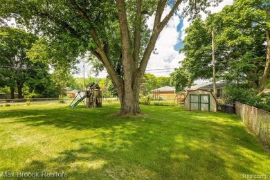 Meticulously maintained brick Ranch on a double lot in South on Western Golf and Country Club in Michigan - for sale on GolfHomes.com, golf home, golf lot