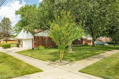 Meticulously maintained brick Ranch on a double lot in South on Western Golf and Country Club in Michigan - for sale on GolfHomes.com, golf home, golf lot
