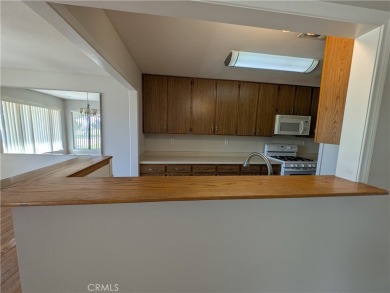 Extremely charming and well taken care of, this two-bedroom on Silver Lakes Golf Course in California - for sale on GolfHomes.com, golf home, golf lot