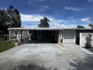 This beautifully updated 2-bedroom, 2-bathroom unfurnished home on Lake Henry Golf Club in Florida - for sale on GolfHomes.com, golf home, golf lot