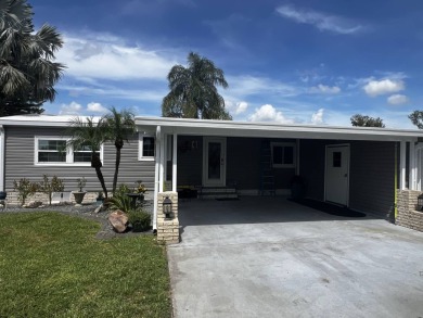 This beautifully updated 2-bedroom, 2-bathroom unfurnished home on Lake Henry Golf Club in Florida - for sale on GolfHomes.com, golf home, golf lot