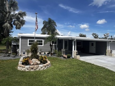 This beautifully updated 2-bedroom, 2-bathroom unfurnished home on Lake Henry Golf Club in Florida - for sale on GolfHomes.com, golf home, golf lot