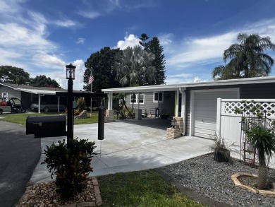 This beautifully updated 2-bedroom, 2-bathroom unfurnished home on Lake Henry Golf Club in Florida - for sale on GolfHomes.com, golf home, golf lot