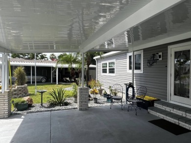 This beautifully updated 2-bedroom, 2-bathroom unfurnished home on Lake Henry Golf Club in Florida - for sale on GolfHomes.com, golf home, golf lot