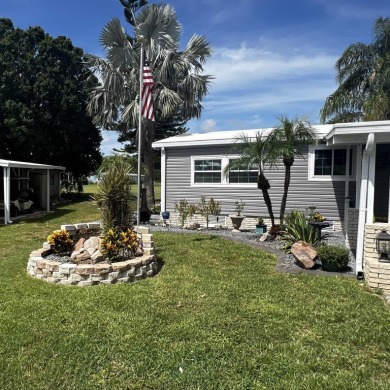 This beautifully updated 2-bedroom, 2-bathroom unfurnished home on Lake Henry Golf Club in Florida - for sale on GolfHomes.com, golf home, golf lot