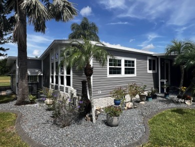 This beautifully updated 2-bedroom, 2-bathroom unfurnished home on Lake Henry Golf Club in Florida - for sale on GolfHomes.com, golf home, golf lot