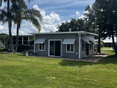 This beautifully updated 2-bedroom, 2-bathroom unfurnished home on Lake Henry Golf Club in Florida - for sale on GolfHomes.com, golf home, golf lot