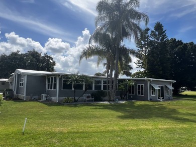 This beautifully updated 2-bedroom, 2-bathroom unfurnished home on Lake Henry Golf Club in Florida - for sale on GolfHomes.com, golf home, golf lot