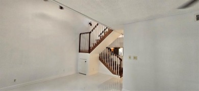 Lovely townhome. It features fresh paint, new porcelain tile on on Woodmont Country Club in Florida - for sale on GolfHomes.com, golf home, golf lot